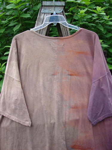 Barclay Center Seam Wide Line Tee Tree Moons Mottled Sunset OSFA displayed on a wooden swinger, showcasing its boxy shape, drop shoulders, and distinct vertical center seam, reflecting BlueFishFinder's vintage style.