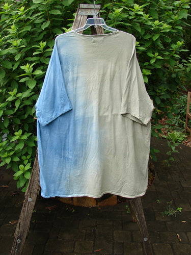 Barclay Art Tee Double Moon Blossom Mottled Blue Dusk OSFA, featuring a tunic length with drop shoulders, loose three-quarter sleeves, and rounded neckline, displayed on an outdoor clothesline.