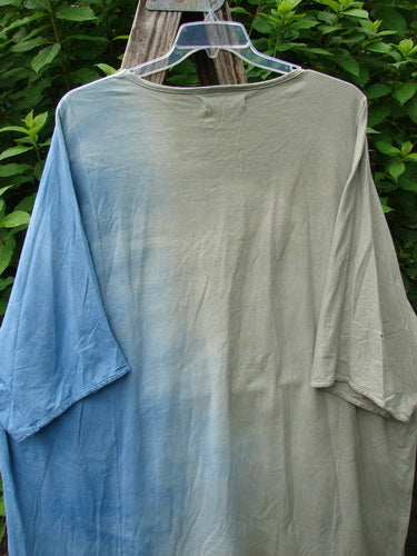 Barclay Art Tee Double Moon Blossom Mottled Blue Dusk OSFA features a longer tunic length, drop shoulders, and loose three-quarter sleeves, displayed on a hanger for a detailed view.