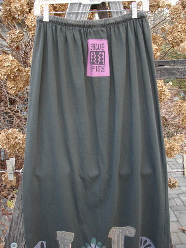1993 Drawcord Skirt Column Black Sand Size 2: A grey skirt with a pink logo and tag. Full elastic and rope waistline, slight bottom flare.