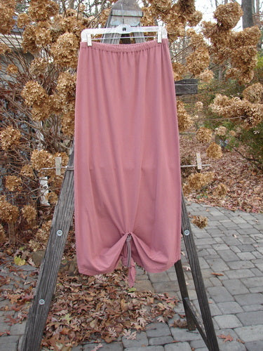 1994 Gather Skirt Unpainted Gourd Size 1: A pink skirt with sectional panels and a replaced elastic waistband, perfect for varying lengths.