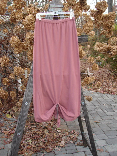 1994 Harvest Gather Skirt Unpainted Gourd Size 1 displayed draped over a wooden ladder, highlighting its sectional panels and versatile length options.