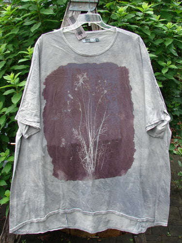 Barclay NWT Art Tee Floral Reach Raincloud Grey OSFA features a plant illustration on a t-shirt, showcasing a longer tunic length with loose three-quarter sleeves and a rounded neckline.