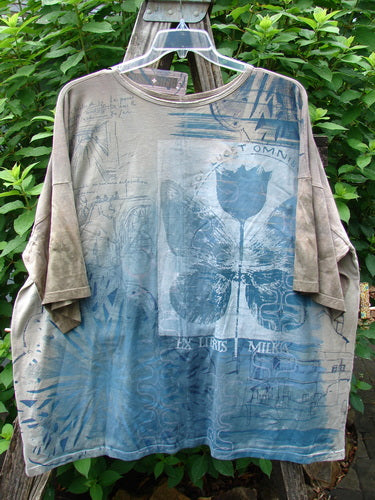 Barclay NWT Center Seam Wide Line Tee Tulip features a close-up of its unique design, showcasing the rounded neckline, drop shoulders, and boxy shape, emphasizing its creative individuality from Bluefishfinder.com.