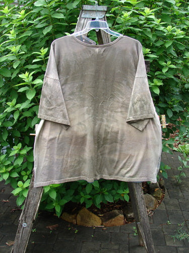 Barclay NWT Center Seam Wide Line Tee displayed on a swinger, featuring a rounded neckline, significant drop shoulders, and a boxy shape with a vertical center seam, embodying the Tulip Garden theme.