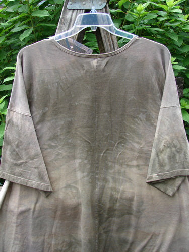 Barclay NWT Center Seam Wide Line Tee Tulip Mottled Brown Blue OSFA displayed on a clothes rack, showcasing its wide, boxy shape, drop shoulders, and distinctive center seam.