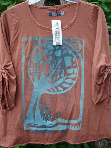 Barclay NWT Draw Gather Sleeve Cafe Top featuring Moon Tree theme; close-up of a rounded neckline with swinging A-line shape and cozy wide sleeves, showcasing organic cotton's texture from Bluefishfinder.com.