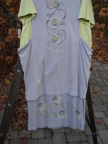 1997 Tunic Dress Curly Garden Dawn Mellon Size 1 displayed on a rack, featuring a straighter longer shape and curly garden-themed paint, highlighting vintage Blue Fish Clothing's creative design.