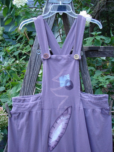 1996 Souvenir Jumper Turn Path Petunia Size OSFA, featuring a criss-cross back, two-button front, painted bib, and gathered skirt.