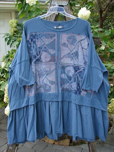 Barclay Batiste Banded Bottom Tunic Quad Sprig Navy OSFA featuring a blue pattern, dolman sleeves, rounded neckline, and a boxy shape with a varying hem.
