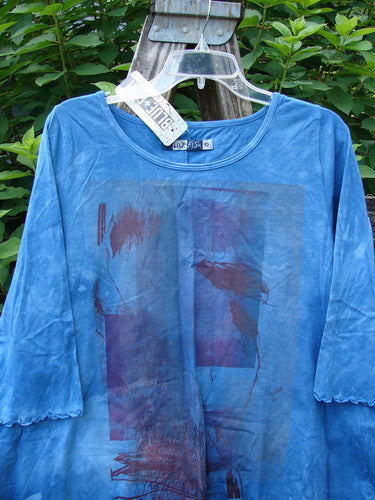 Barclay NWT Three Quarter Sleeved Cafe Tee in Shadow Blend Mottled Blue Sky, displayed on a hanger. Features a rounded neckline, curly edges, and an A-line shape, embodying BlueFishFinder's vintage style.