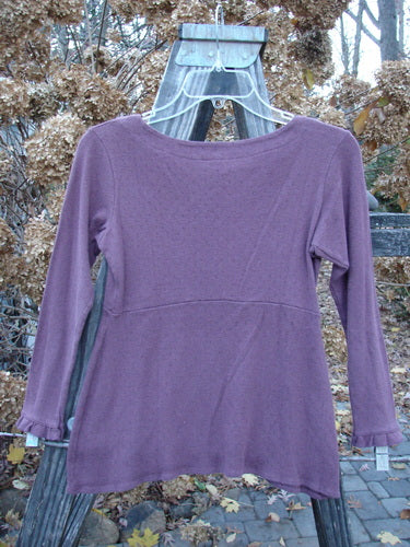 2000 Wool Pointelle Anais Top in Murple, size 0. Soft and cozy merino wool shirt with empire waist seam, lettuce edging, and narrow lower sleeves.