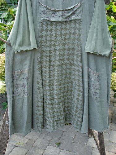 Barclay Cotton Sleeve Upper Pocket Dress Tiny Floral Moss Size 2, featuring a rounded neckline, sectional panels, upper bodice pocket, drawcord back, cotton lettuce edge sleeves, and an A-line flair.