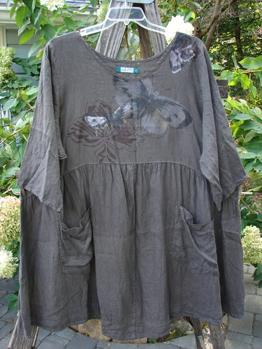 Barclay Linen Two Pocket Dolly Dress Butterfly Wood Size 2, featuring a flouncy lower skirt, dropped empire waist, wide hem sweep, dual pockets, and butterfly theme paint on lightweight linen.