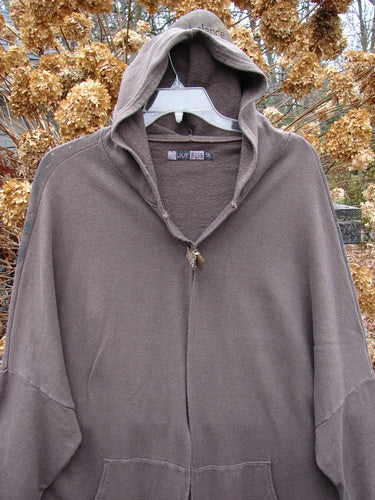 Barclay Hemp Cotton Open Front Hooded Cloak Twig Stone OSFA, featuring a cozy hood, kangaroo pockets, dolman sleeves, and twig-themed back design, perfect for layering and mixing with other pieces.