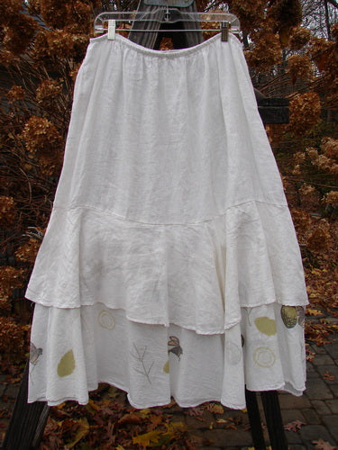 Barclay Linen Two Tier Ruffle Skirt Tiny Birdie White Size 2, featuring a floral design, double A-line fall, and a large lower ruffle with painted bird accents.