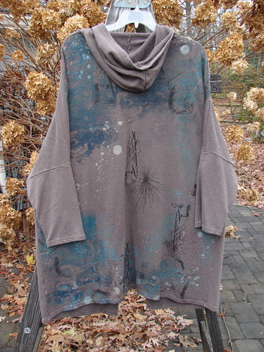 Barclay Hemp Cotton Open Front Hooded Cloak Twig Stone OSFA displayed, featuring a cozy hood, kangaroo front drop pockets, and a unique blue twig paint design on the back.