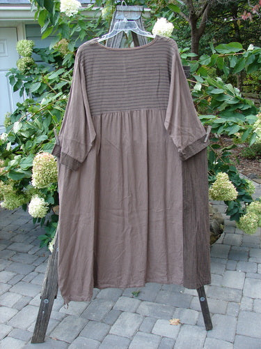 Barclay Linen Gathered Hem Single Pocket Dress Tall Sprig Sand Stone Size 2 displayed on a swing with three-quarter length sleeves, angled drop pocket, and a vertical panel print.