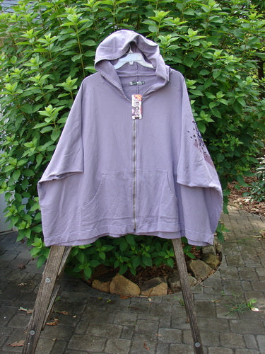 Barclay NWT Hooded Postcard Zipper Jacket Vest Rear Daisy Violet OSFA features a cozy hood, full zipper front, roomy pockets, dolman shoulders, and a sweeping hemline, perfect for expressing individuality.