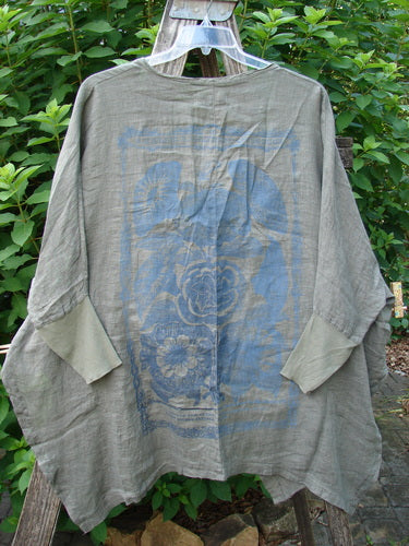 Barclay NWT Linen Open Front Cheerful Crinkle Cardigan Floral Caper Size 0 displayed on a clothesline, highlighting its dolman sleeves, ribbed cuffs, and floral blossom theme, embodying BlueFishFinder's vintage charm.