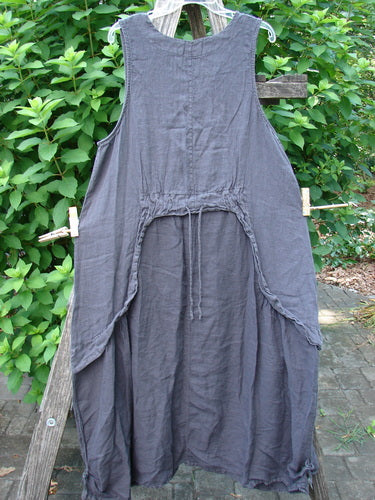 Barclay NWT Linen Explorer Jumper Contour Garden Black Sand Size 0 hanging outdoors, showcasing its scoop neckline, full A-lined shape, generous upper pocket, and unique contour garden design details.