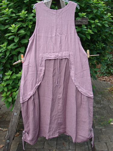 Close-up of Barclay NWT Linen Explorer Jumper Contour Pansy Patch Tulsi Rose Size 0, showcasing a scoop neckline, generous upper pocket, and intricate overlay bodice with pansy theme paint detailing.