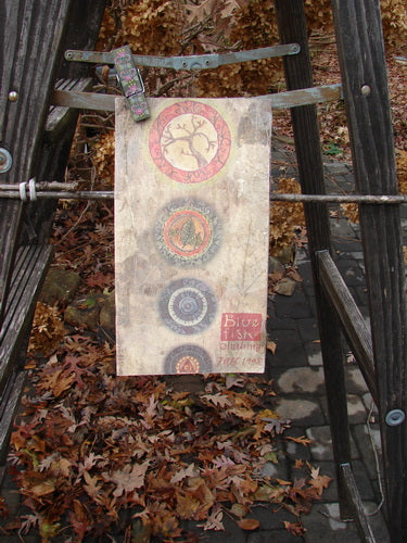 1998 Fall Catalog Wander in Autumn One Size displayed on a wooden ladder outdoors, showcasing vintage images, color charts, and art from the Blue Fish 1998 Fall Release.