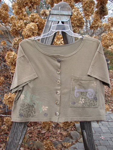 1994 Song Top Garden Bark Size 1: Brown, medium-weight cotton shirt with a wide, boxy shape, shallow neckline, vintage buttons, oversized painted breast pocket, and mixed theme paint design.