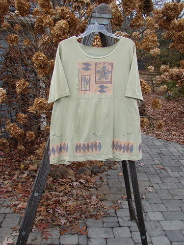 1993 3 Square Dress Trinket Diamond Kelp OSFA displayed on a hanger, featuring a rounded neckline, six sectional panels, and intricate diamond and trinket designs, highlighting its unique collectible status.