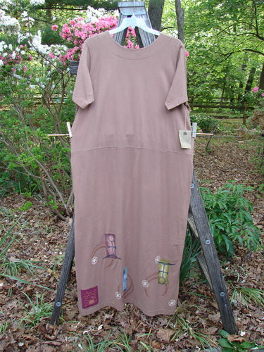 The 1998 NWT Eclipse Dress Celtic Fauna Size 2 features a scooped neckline, straighter silhouette, side pockets, yoke waist, and vibrant Celtic paint, embodying BlueFishFinder's vintage, creative fashion ethos.