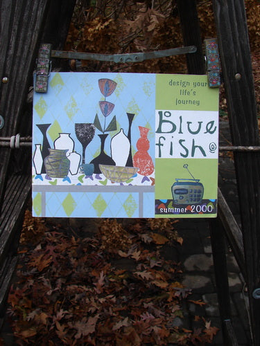 Image: A sign on a ladder with a close-up of a book, brown leaves, and a metal bar with holes. Alt text: "2000 Summer Catalog Life's Journey One Size: Blue Fish vintage catalog featuring color charts, line drawings, vintage images, and more."