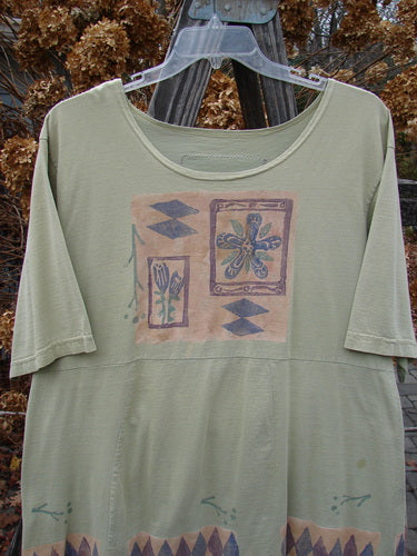 1993 3 Square Dress Trinket Diamond Kelp OSFA: A green shirt with a design on it, resembling the 4 Square Bottom, emphasizing sectional panels.