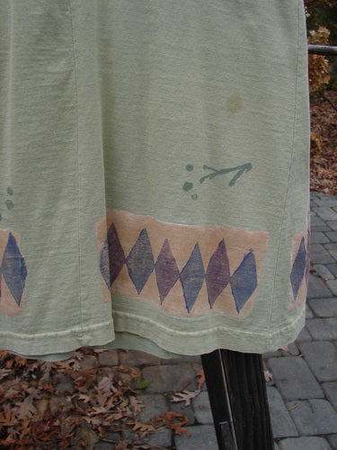 Close-up of the 1993 3 Square Dress Trinket Diamond Kelp OSFA, showcasing its intricate diamond and trinket themed design, rounded neckline, and sectional panels from BlueFishFinder.com.