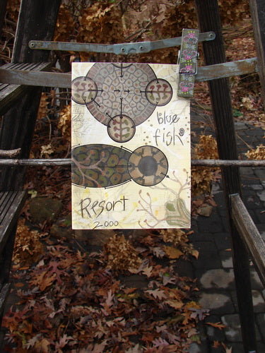 2000 Resort Catalog Change and Growth One Size featuring intricate diagrams, circular designs, and poetic texts, set against an outdoor autumn backdrop with handwritten art and vintage imagery.