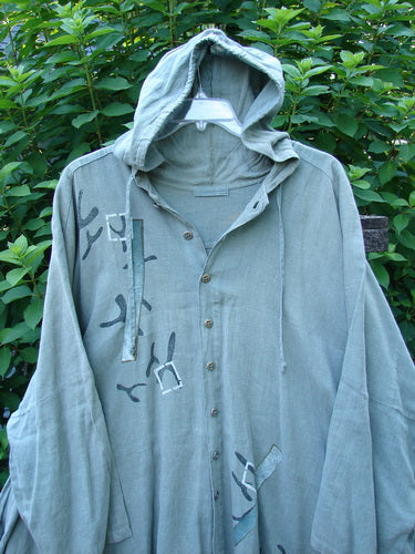 1997 Linen Seaspray Jacket Bamboo Lagoon Size 3 featuring an oversized floppy drawcord hood, dolman sleeves, shirttail hemline, and bamboo-themed paint, embodying vintage charm from Bluefishfinder.com.