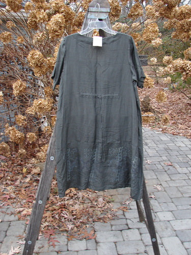 2000 NWT Hemp Silk V Over Top Biology Domino Size 1 displayed on a clear hanger over a wooden stand, showcasing a deep V neckline and flowy A-line shape with sectional bodice detailing.