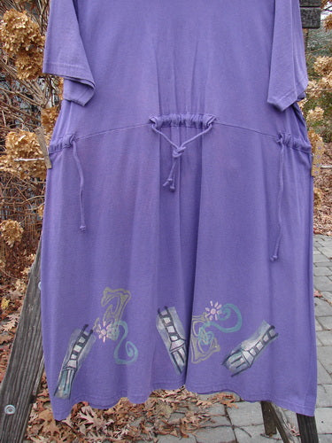 Image alt text: "1994 Elfin Dress in Purple Nuit with Mixed Theme design, featuring dramatic collar, sailor-like rear collar, A-line shape, rear tie tunnel, side ties, widening lower hemline, and empire waist seam. Bust 52, Waist 52-54, Hips 52-54, Sweep 80, Length 39 inches."