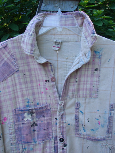 Magnolia Pearl Flannel Patched Surfside Shirt Sun Bleached OSFA, featuring hand-distressed patches, button cuffs, varying hemline, and paint splatter detailing, capturing the essence of vintage, artistic fashion from Bluefishfinder.com.