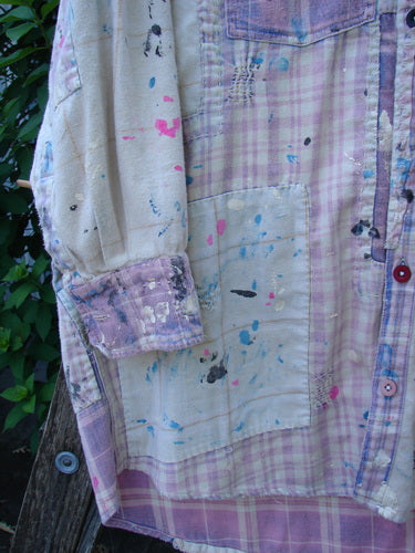 Close-up of Magnolia Pearl Flannel Patched Surfside Shirt Sun Bleached OSFA, showcasing detailed hand distressing, generous patching, button cuffs, and unique paint splatter mending, reflecting BlueFishFinder's vintage style ethos.