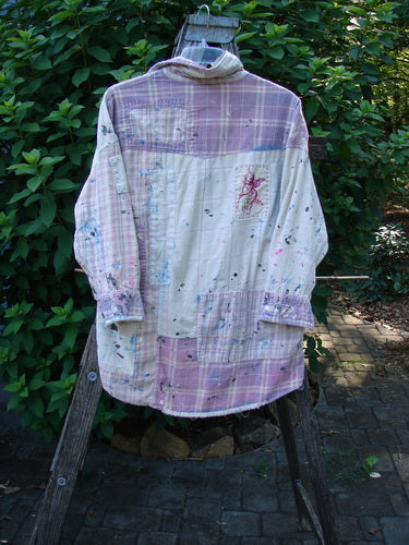 Magnolia Pearl Flannel Patched Surfside Shirt Sun Bleached OSFA, showcasing generous patching, hand distressing, button cuffs, and unique paint splatter detailing, highlighting its creative, vintage-inspired craftsmanship.