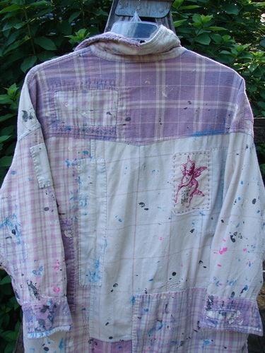 Magnolia Pearl Flannel Patched Surfside Shirt Sun Bleached OSFA features a heavily distressed design with patchwork, paint splatters, button cuffs, and a unique hemline, reflecting Bluefishfinder.com's vintage, creative style.