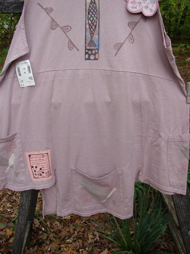 The 1994 NWT Flower Pot Top Single Fish Patio Rose Size 3 features a double leaf theme, unique drop pockets, a rounded ribbed neckline, flared A-line shape, and signature blue fish patch.