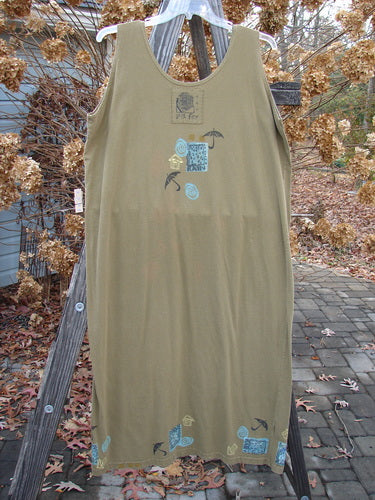 1992 Tank Dress Rain Rosemary OSFA: A dress on a wooden rack, close-up of a shirt, leaves on a stone surface, wooden board with a blue button, close-up of a dress, close-up of a wall.