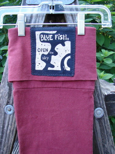 1995 Reprocessed Holiday Stocking Festive Hollyberry OSFA features vibrant blue fish designs and a signature patch, ideal for collectors. Its durable cotton and festive theme make it a unique vintage gift choice.