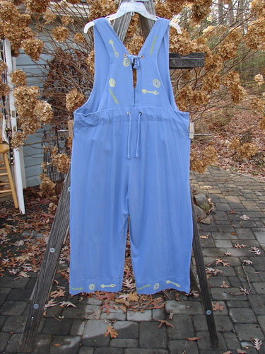 1993 Railroad Overall Jumper Abstract Tool Periwinkle Size 1: A blue overall with a design on it, featuring wide swingy lowers, an empire waist seam, and rear waistline drawcord.