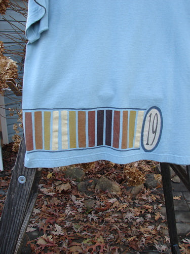 1998 Short Sleeved Tee Number 19 Pool Size 1, featuring a clear blue color, thicker ribbed neckline, and super drop shoulders, made from mid-weight organic cotton.