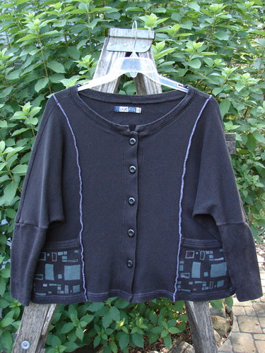 Barclay Thermal Exterior Stitch Two Pocket Jacket Geos Black Size 0 features a rounded neckline, long dolman sleeves, double drop exterior painted pockets, and vertical exterior stitchery, showcasing a unique square box crop shape.