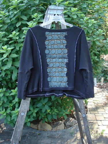 Barclay Thermal Exterior Stitch Two Pocket Jacket Geos Black Size 0, featuring a rounded neckline, long narrowing sleeves, double drop exterior painted pockets, and vertical exterior stitchery with a wide square box crop shape.