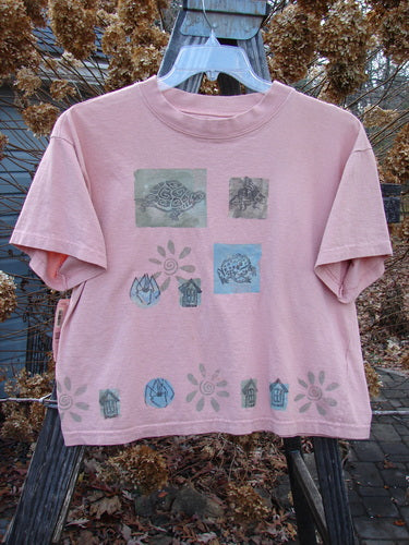1994 NWT Short Sleeved Tee Garden Critter Seashell Size 3 featuring unique garden critter illustrations, a slightly flared bottom, and a thick ribbed neckline, perfect for vintage Blue Fish Clothing enthusiasts.