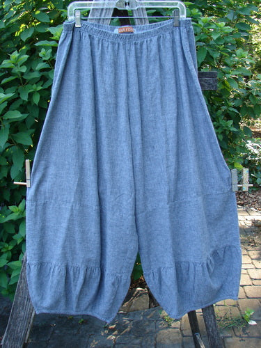 Barclay Hemp Cotton Meadow Pant Unpainted Indigo Stripe Size 1, features a full elastic waist, gathered horizontal panels, and a slightly cropped length, hanging outdoors on a clothesline.